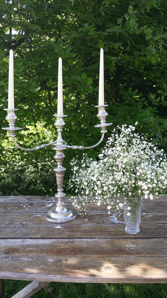 beauty and the beast style vintage candelabra and vintage glass vase to hire with gypsophila