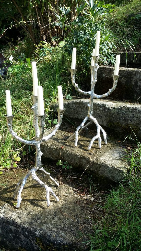 two twig style candelabras on Cotswolds stone steps for hire