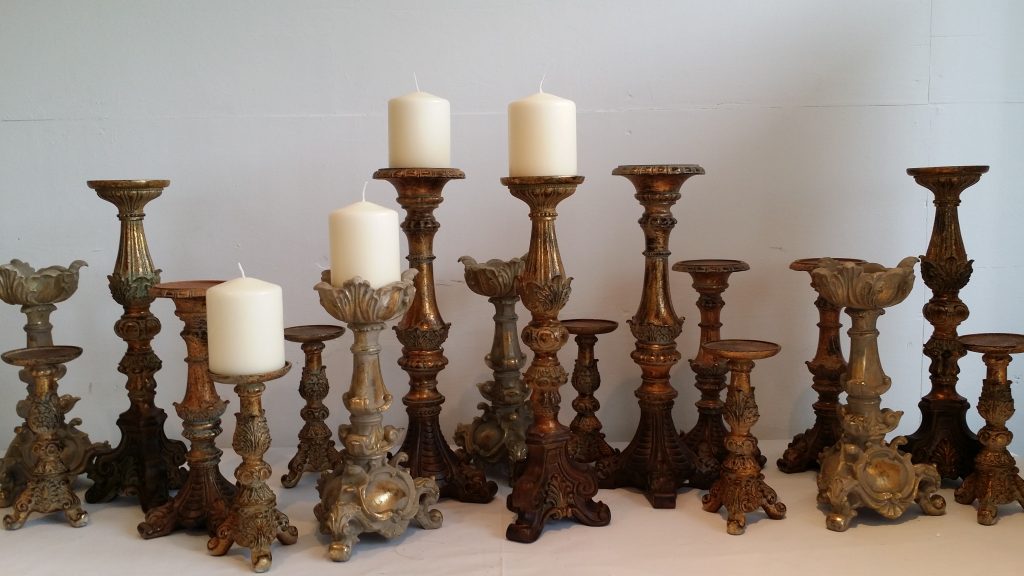 A large selection of brown and gold ornate candlesticks we name the rococo candlestick all these are large able to hold large pillar candles