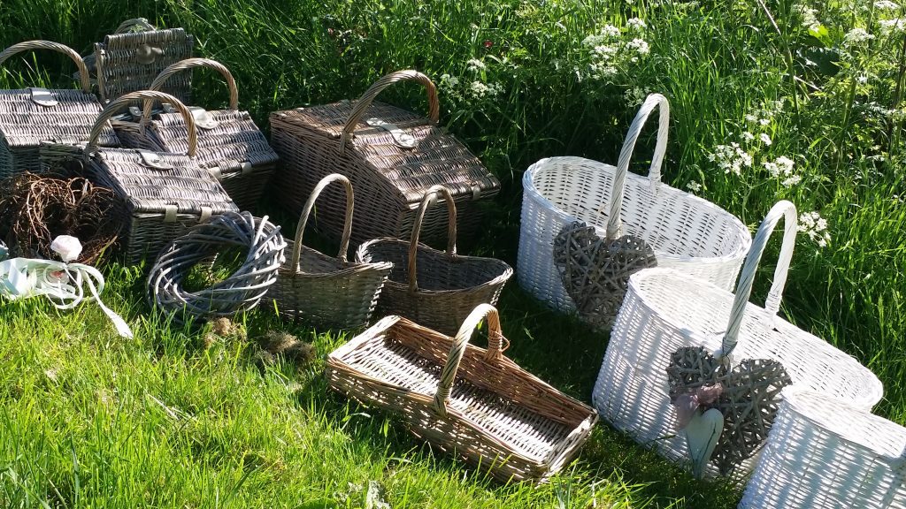 A selection of wicker baskets and troughs, wicker hearts and wreaths to hire