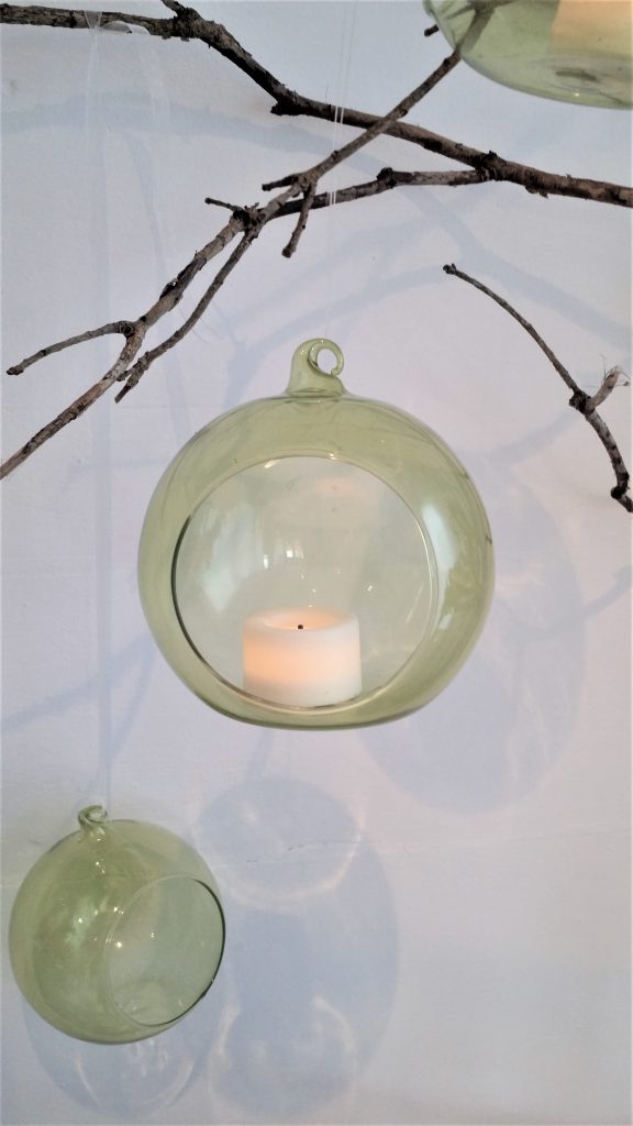 A glass hanging bauble with a hole to put tealights for hire