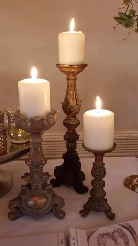 A large selection of brown and gold ornate candlesticks we name the rococo candlestick all these are large able to hold large pillar candles to hire