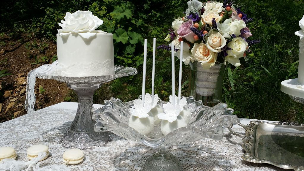 glass pedestal wedding cake stands with different styles and shapes and sizes for mix and match or a sweet station for hire