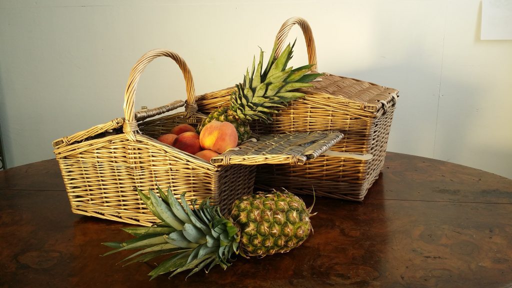 two wicker picnic baskets filled with fruit to hire