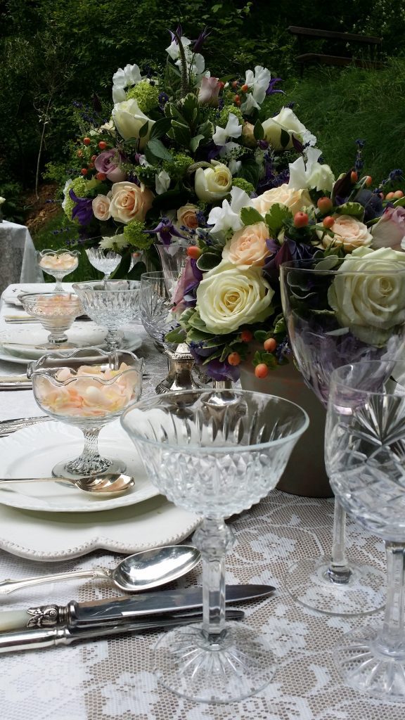 Vintage silver cutlery and glass sundae bowl with cut crystal champagne saucer to the right hand side to hire