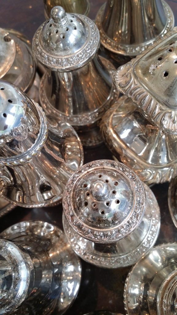 large selection of silver vintage salt and pepper pinch pots and shakers to hire
